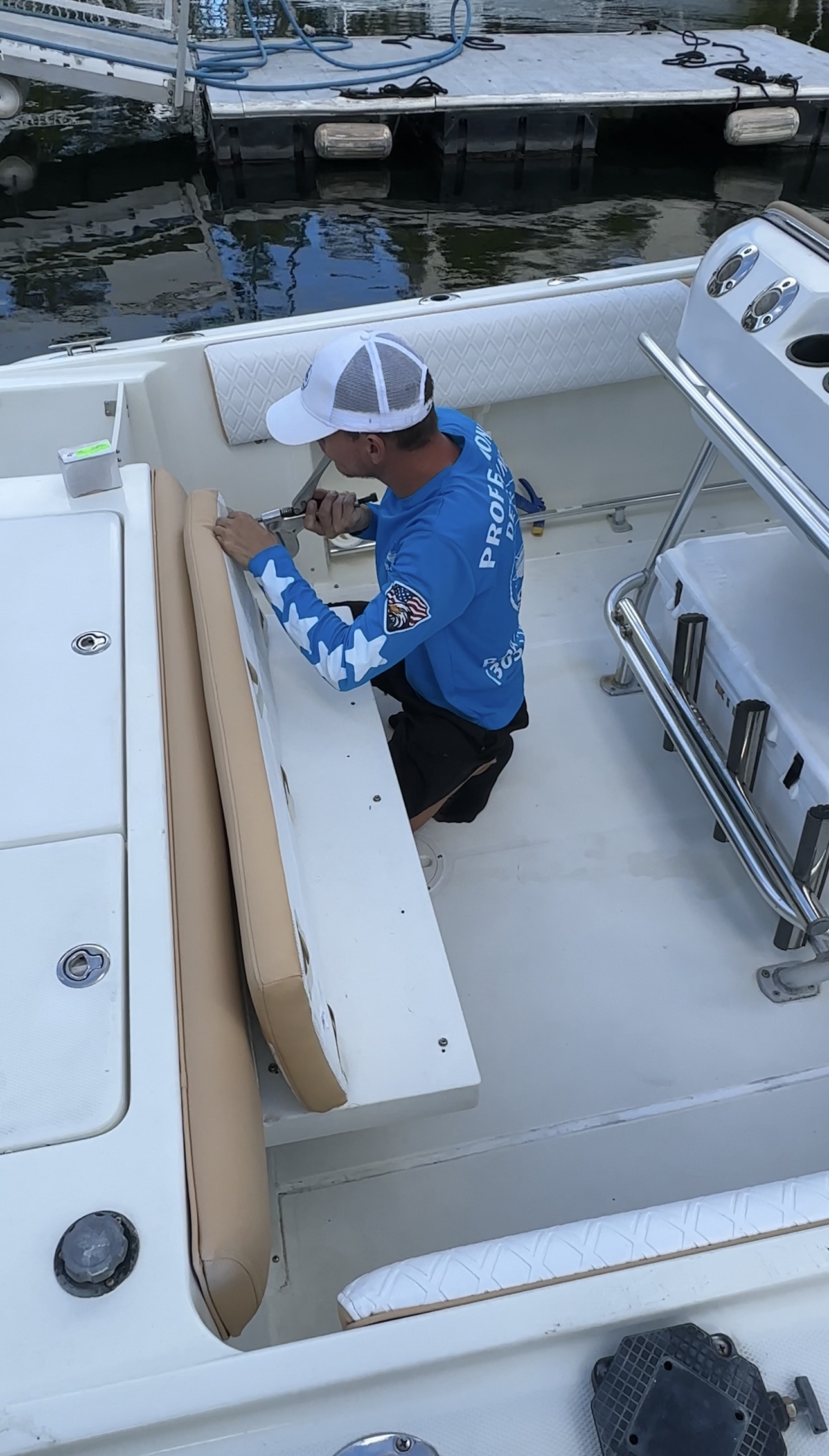 Technician Installing Custom Boat Upholstery