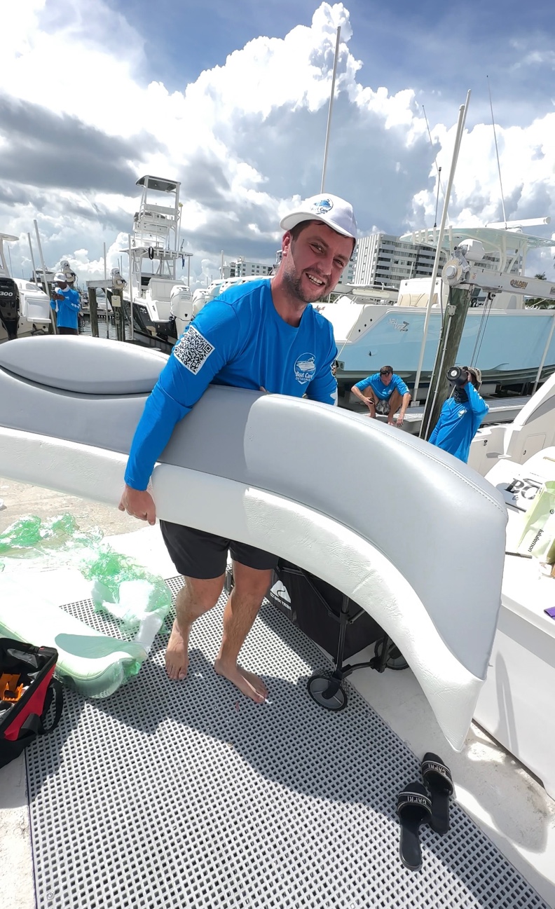 Smiling BoatCare360 team member providing professional boat cleaning service